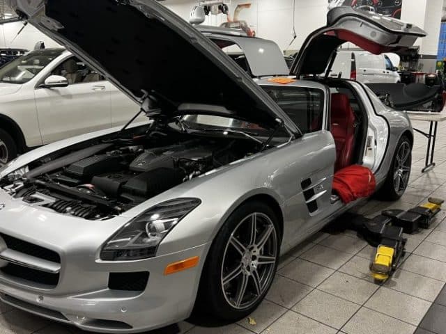 Home 3 Mercedes vehicle on a lift inside the J and N Auto Clinic workshop